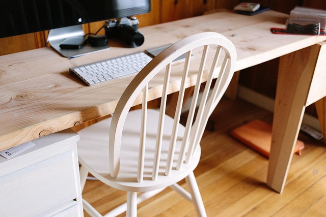 ergonomic home office desk setup with monitor stand and keyboard